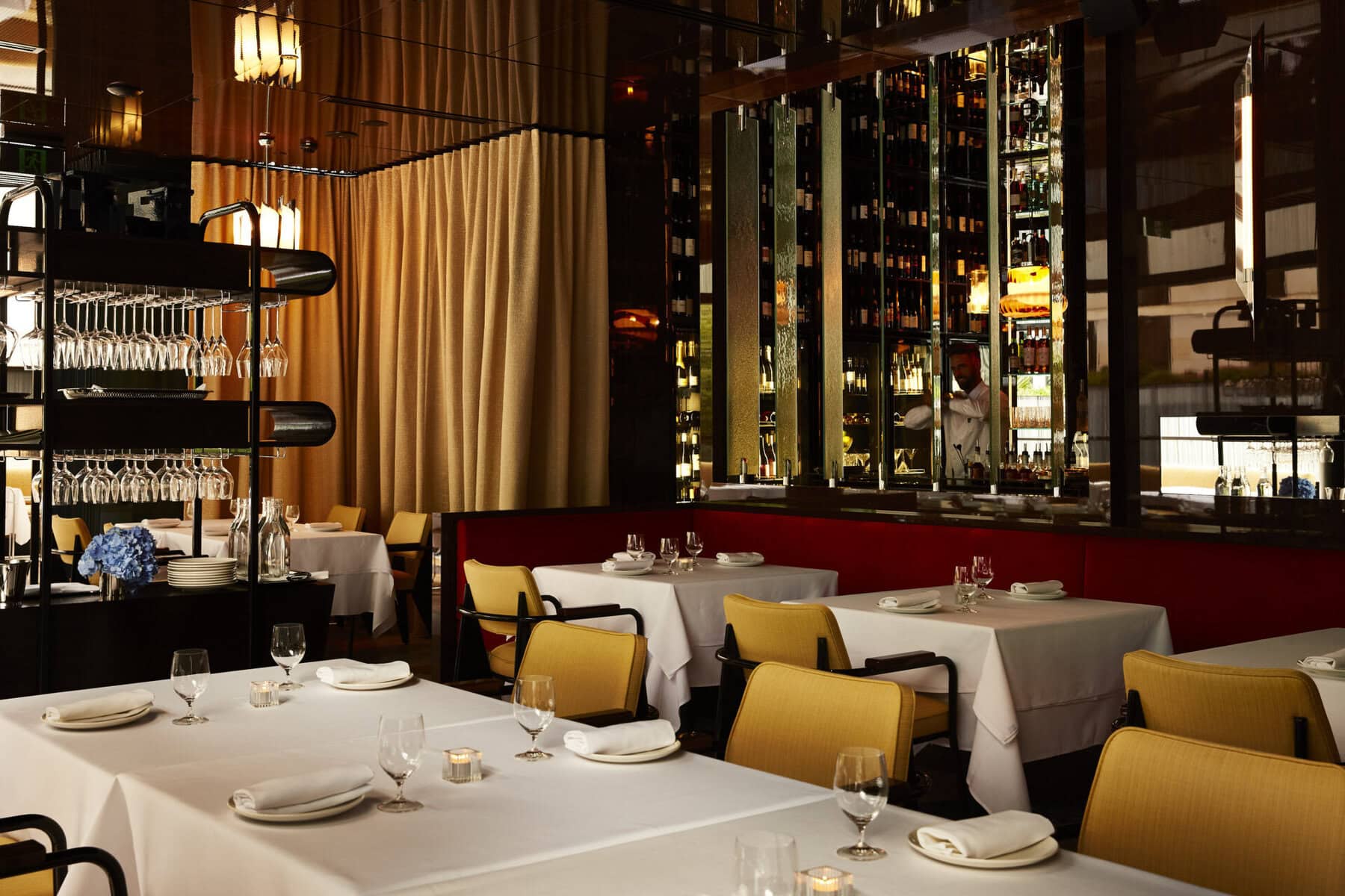 Private dining tables beside the wine display